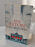 Book titled 'Two Brothers' by Ben Elton on a white surface