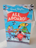 Book cover of 'All Aboard!' by Enid Blyton with illustrations of children on a boat.