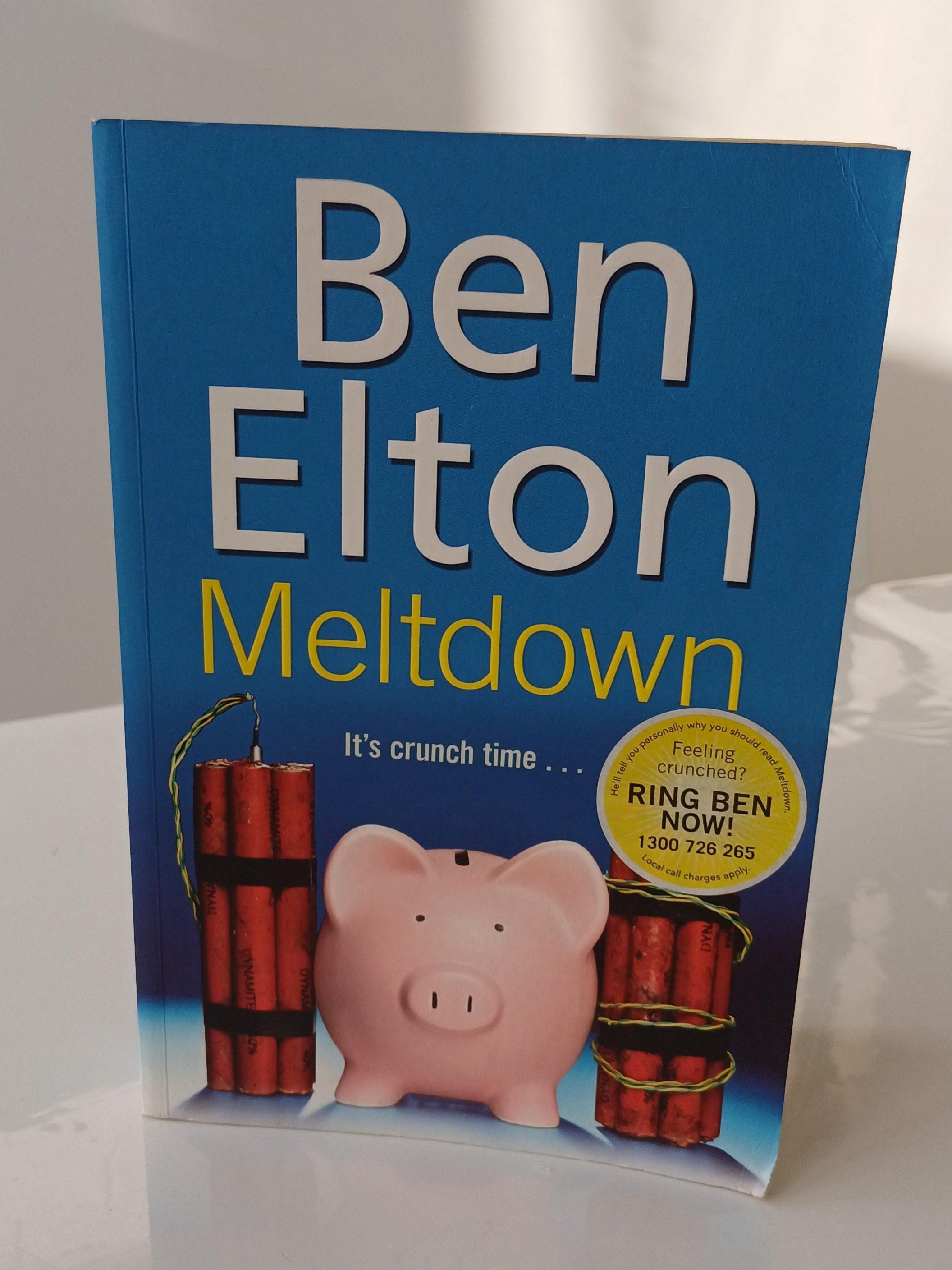 Book titled 'Meltdown' by Ben Elton with a pink piggy bank and red bombs on a blue background.